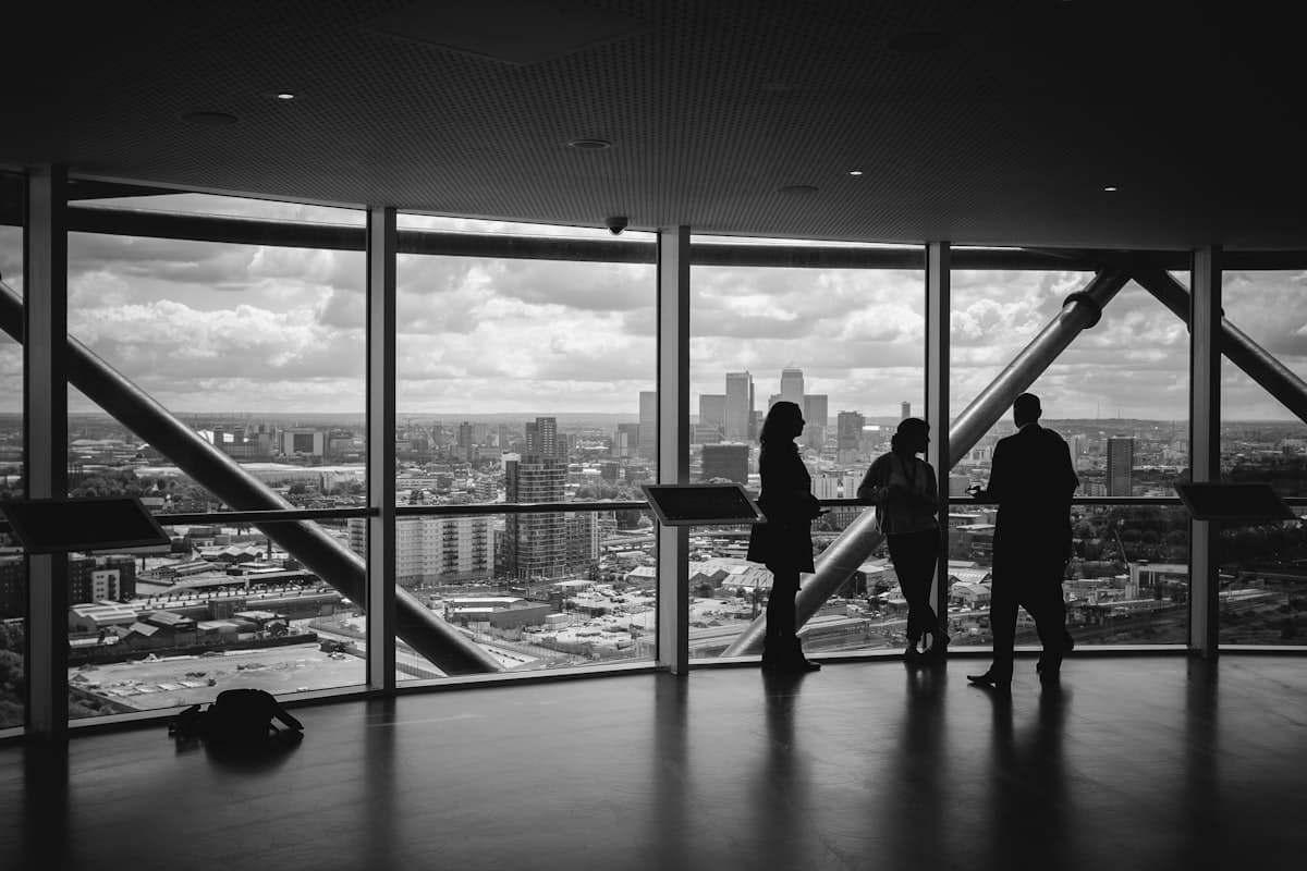 Business professionals meeting in an office with a city view.